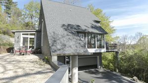 Dramatic geometry and a striking hillside site make this one-owner house outside Ann Arbor a unique retreat.